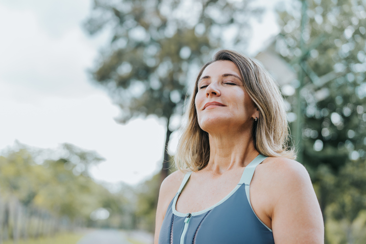 Portrait of a woman breathing fresh air